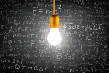 A picture of a light bulb with mathematical formulas in the background. 